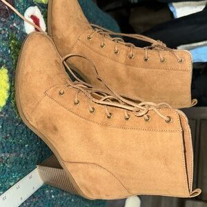 lace up boots. 3.5in heel. minor markings as noted.